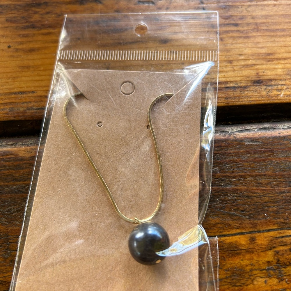 Elegant Gold and Black Necklace